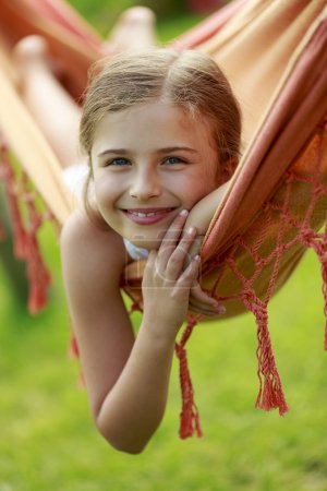 Summer vacation - lovely girl in hammock