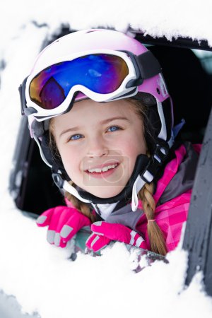 Winter, ski - happy child on the road for ski holidays