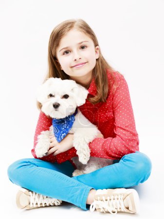 Young girl with  puppy, cute Maltese dog  - best friends