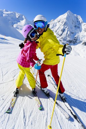 Skiing, skiers on ski run - child skiing downhill, ski lesson