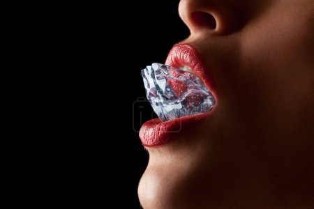 Ice cube in woman's mouth.