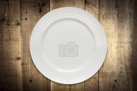 Empty White Plate over Rustic Timber