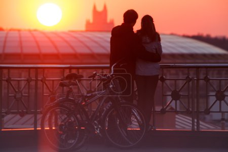 Couple enjoying scenic sunset in the city