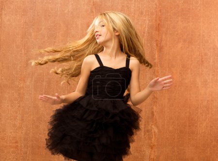 black dress kid girl dancing and twisting vintage