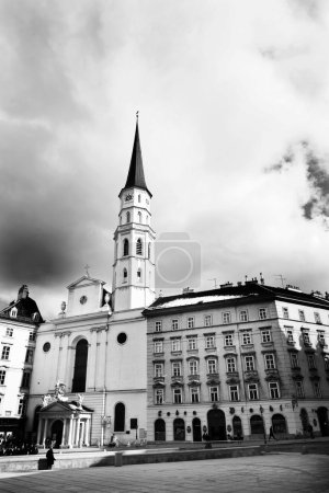 Tall building with tall tower in Vienna, Austria. Black and white