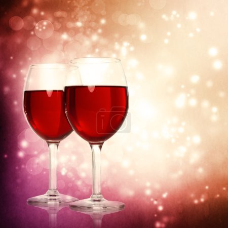 Glasses of Red Wine on a Sparkling Background