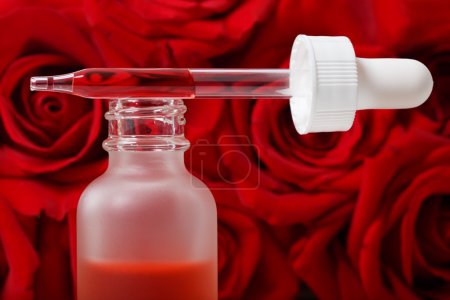 Dropper bottle with red roses