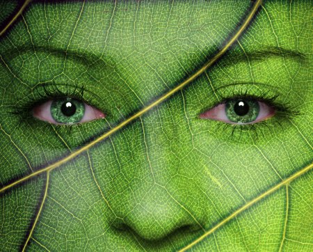 Woman face with leaf texture and green eyes