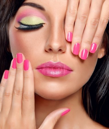 Brunette woman with modern make-up and manicure