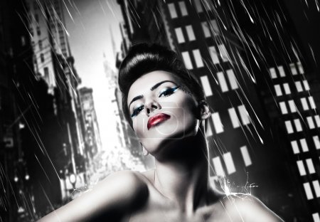 Attractive brunette woman with red lips in rainy city
