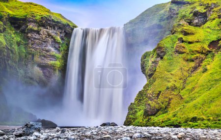 Long exposure of famous Skogafoss waterfall in Iceland at dusk
