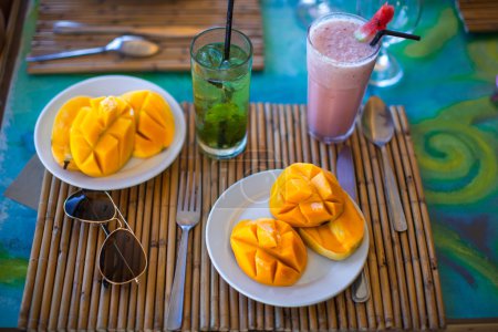 Philippino breakfast with mango and coctails