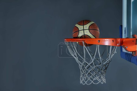 basketball ball and net on grey background