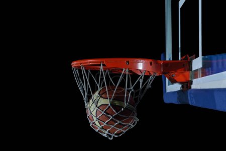 basketball ball and net on black background