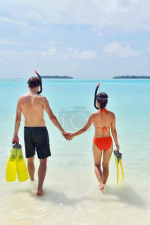 Happy young couple have fun at beach