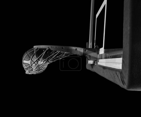 Basketball ball and net on black background