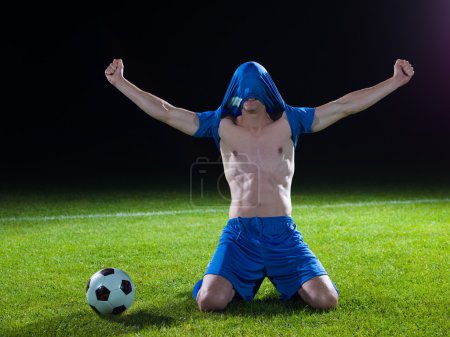 Soccer player with jersey on his head