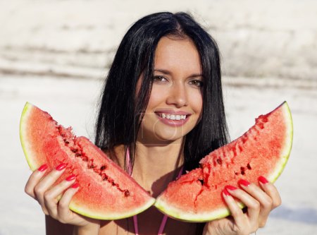 Beautiful girl eats water-melon