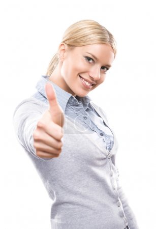 Cute young woman showing thumbs up