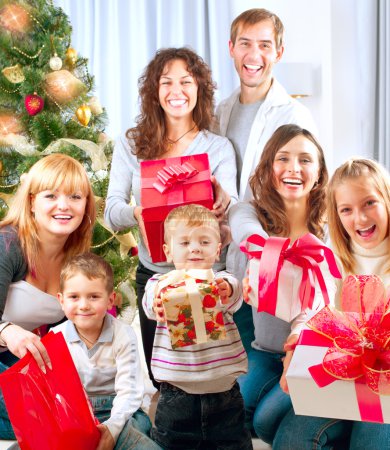 Happy Big Family with Christmas Gifts at Home