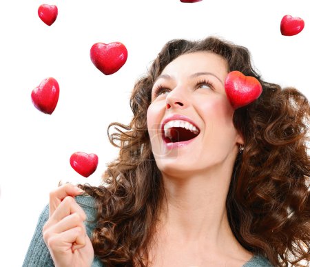 Beauty Young Woman Catching Valentine Hearts. Love Concept