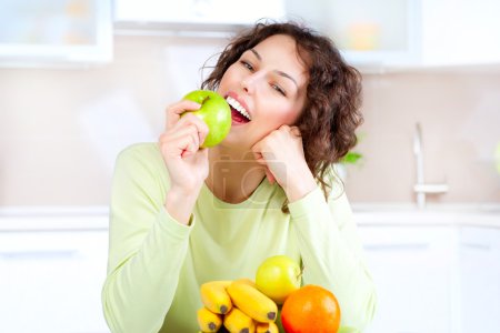 Dieting concept. Healthy Food. Young Woman Eats Fresh Fruit