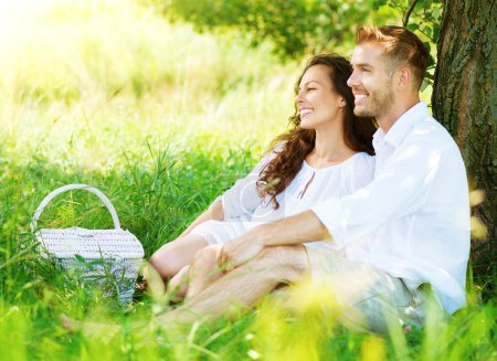 Beautiful Young Couple Having Picnic in Countryside