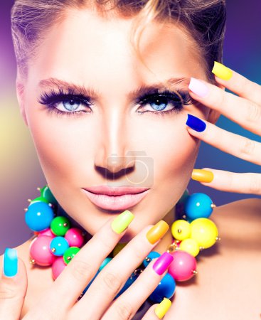 Beauty model girl with colorful nails