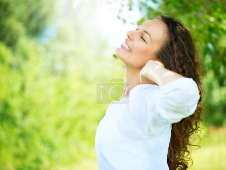 Beautiful Young Woman Outdoor. Enjoy Nature