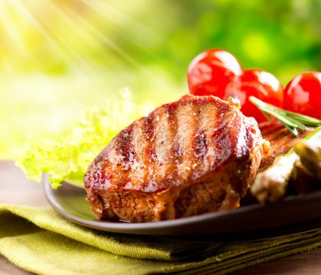 Grilled Beef Steak BBQ. Barbecue Meat Steak outdoor with Vegetab