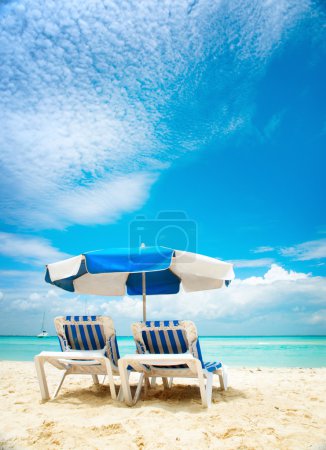 Vacation and Tourism concept. Sunbeds on the beach