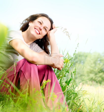 Beautiful Young Woman Outdoors. Enjoy Nature. Meadow