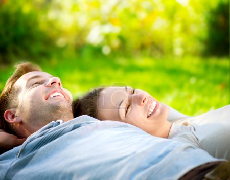 Young Couple Lying on Grass