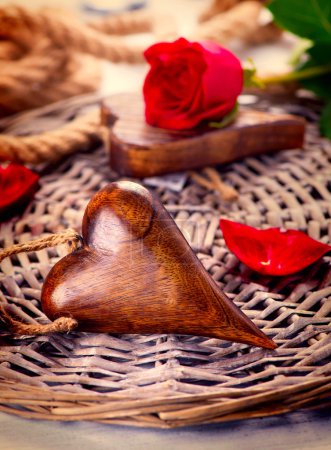 Valentine's Day. Wooden heart over wood background