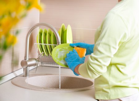 Woman Washing Dishes.