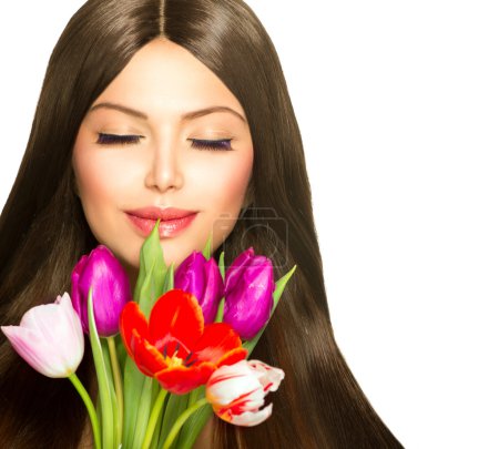 Beauty Woman with Spring Bouquet of Tulip Flowers