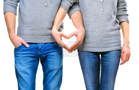 Valentine couple in love showing heart with their fingers