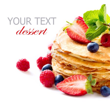 Pancake. Crepes With Berries. Pancakes stack isolated on a White