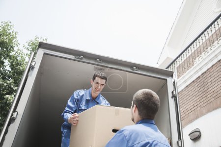 Movers unloading a moving van