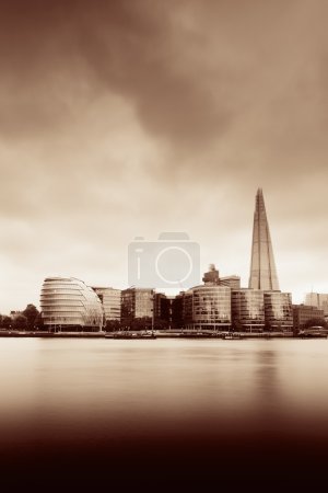 Urban architecture over Thames River in London in black and white.