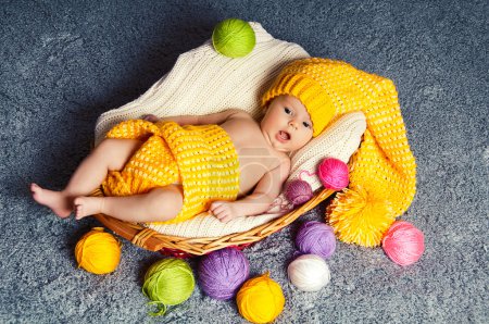 Cute infant baby inside wicker basket