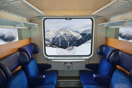 Interior of train and mountains in window