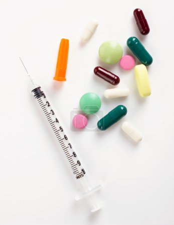 insulin syringe and colorful medicaments