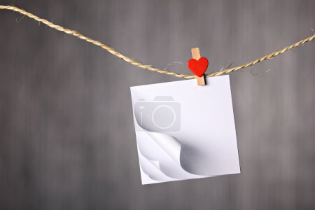 empty notebook hanging on clothesline