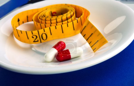 measure and pills for dieting concept