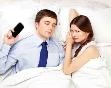 businessman and woman in bed