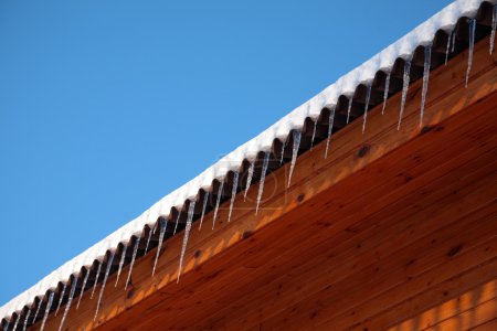 Roof of house with icicles