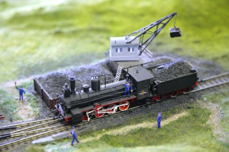 Model of steam locomotive is loaded by coal