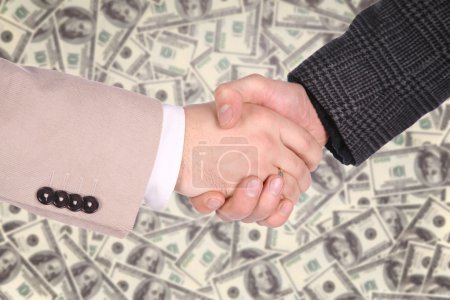 Handshaking on dollar background