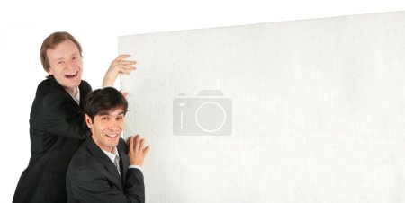 Two businessmen push white plate